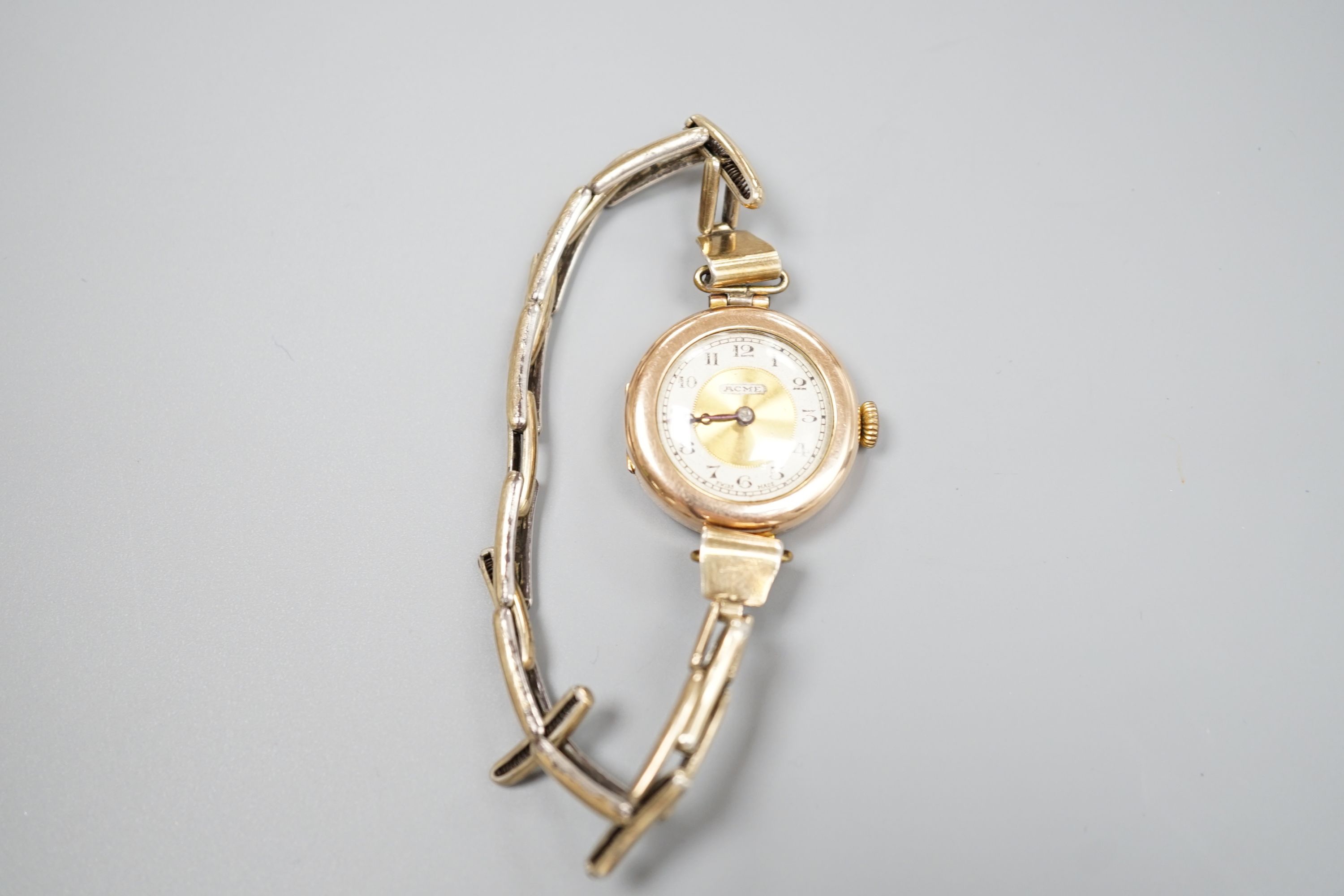 A lady's early 20th century 9ct gold manual wind wrist watch, on a '9ct on Sil' expanding bracelet.